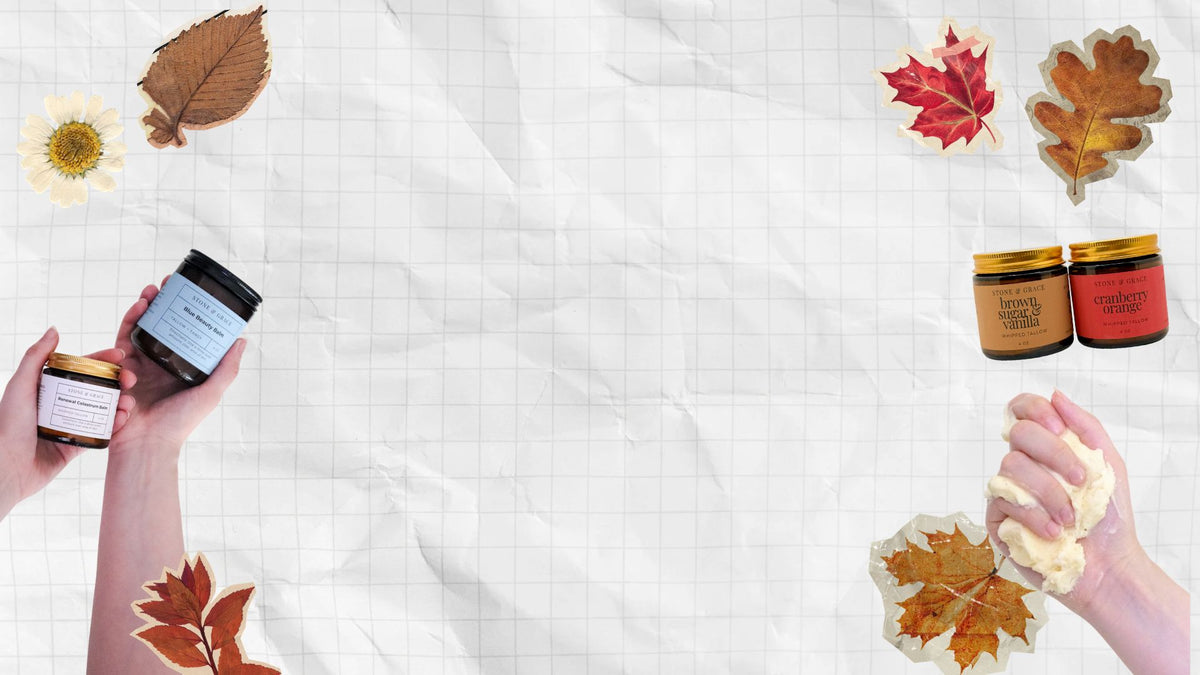Two hands holding small cosmetic jars on the left, and one hand holding cream  on the right, set on a white gridded paper background with autumn leaves and flowers around the edges.