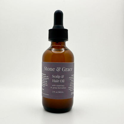 Bottle of Stone & Grace Scalp and Hair Oil with a dropper on a white background
