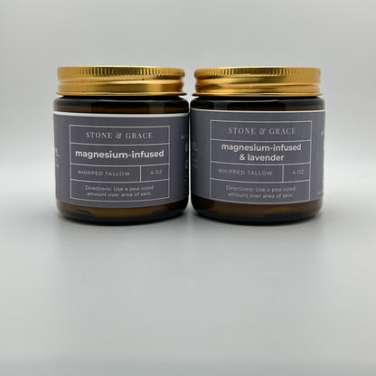 Two jars of Stone & Grace magnesium-infused whipped tallow on a gray background